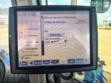 Display screen of a agricultural vehicle's control panel with settings and options.